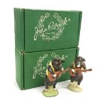 A Beswick china model of a pig playing guitar: Christopher together with another matching figure