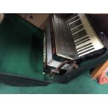 An early 20th century Carlo Carsini piano accordion in case.