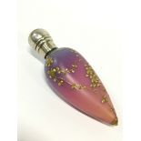 A 19th century Vaseline glass teardrop scent bottle with gilt enamel trailing branch decoration and