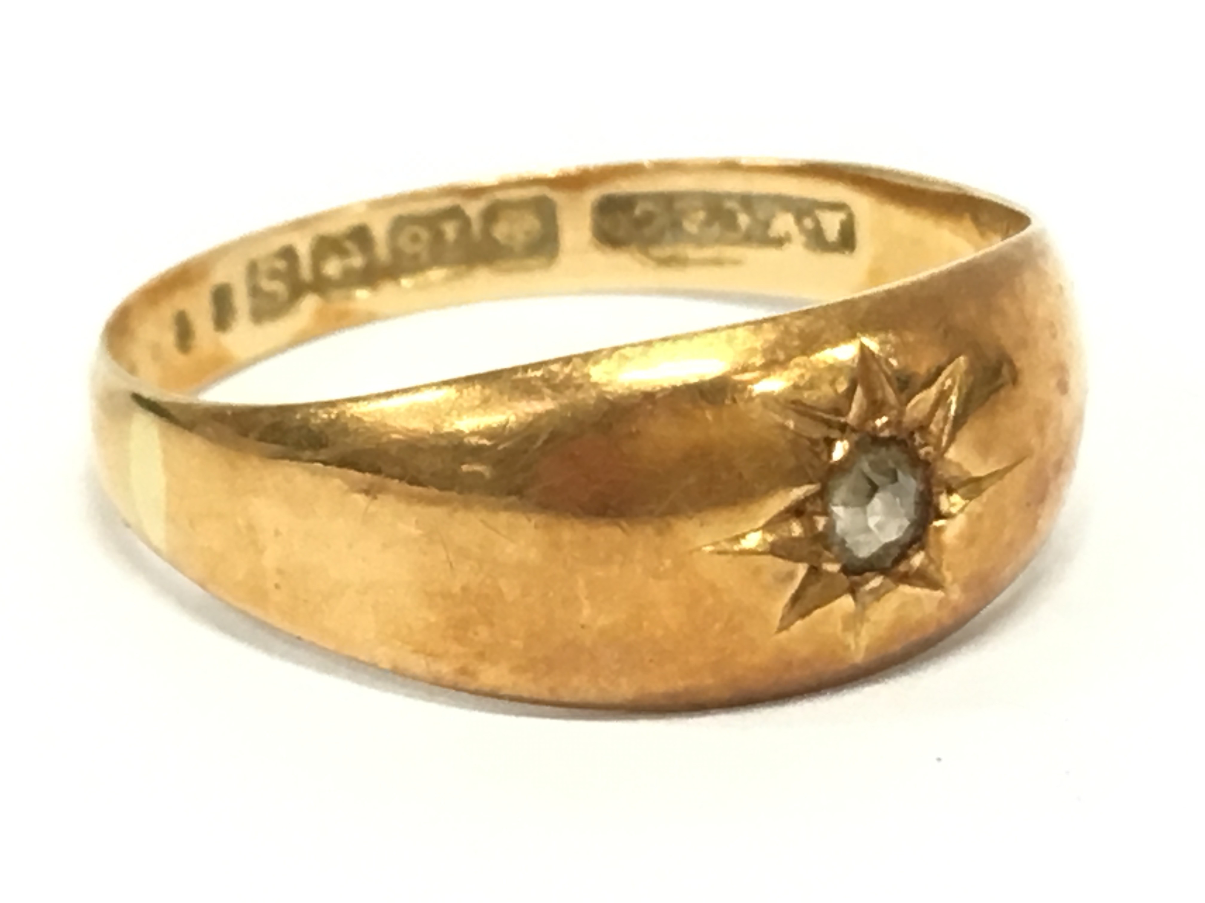 An 18 carat gold diamond set Gypsy ring.(3.