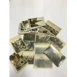 A small quantity of various early 20th century black and white postcards and photo cards including