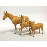 Three various Beswick china horses.