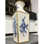 A modern Spanish china vase with blue floral decoration.