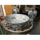 An early Delft china bowl decorated with stylised leaves (examine) together with a pair of Delft