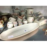 A collection of various white bodied Poole Pottery items together with a Twin Tone coffee set.