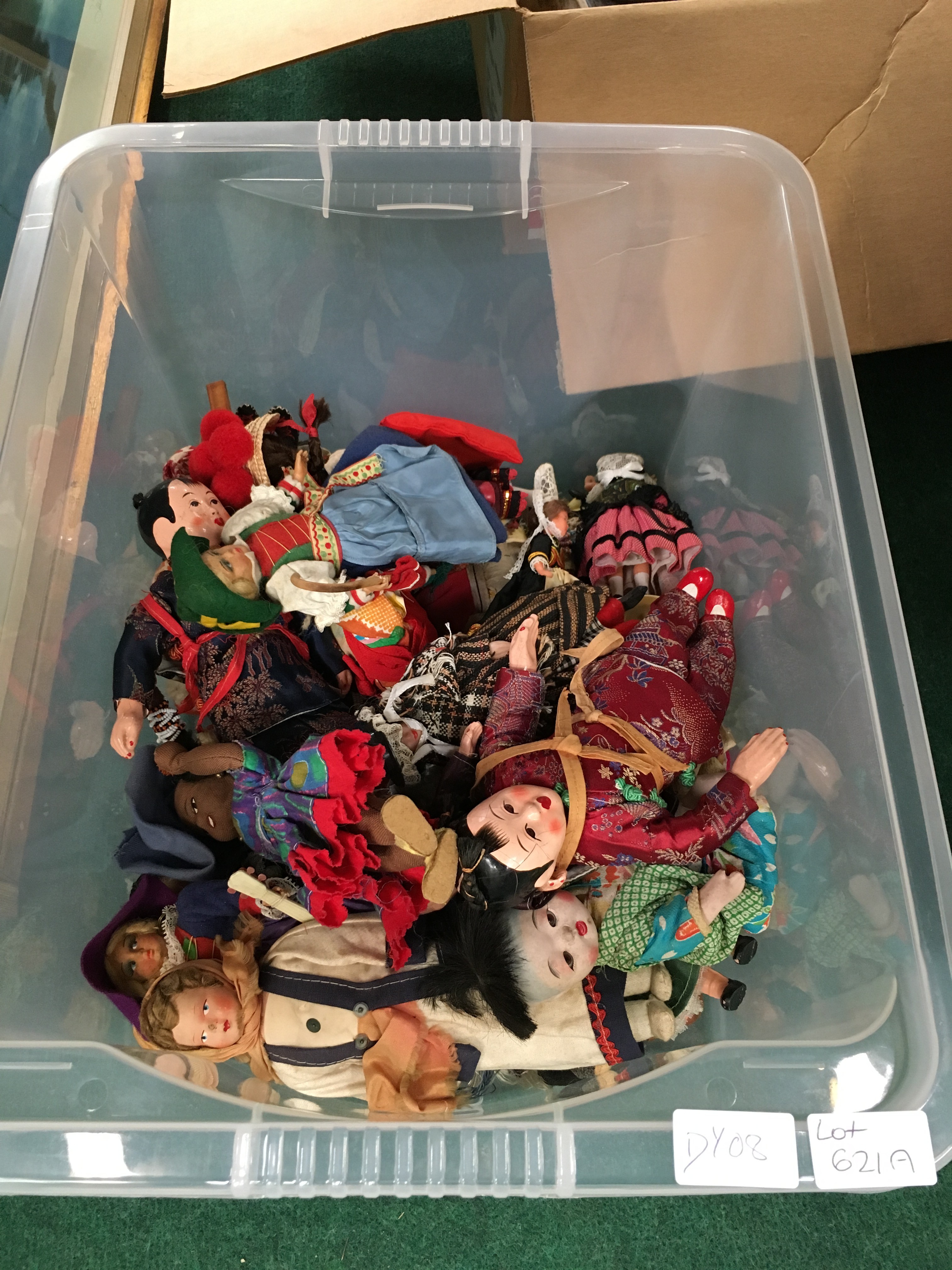 A box containing a quantity of various Chinese and other National costume dolls.