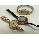 Three 9 carat gold watches, one with a 9 carat gold strap.