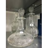 Three moulded glass decanters.