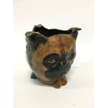 A cold painted bronze ashtray modelled as the faces of an owl, cat and dog.