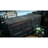 A large early oak panelled mule chest.