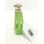 A green Cameo glass scent bottle with silver lid.