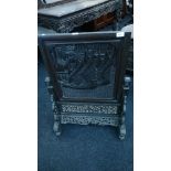 A large Chinese design fire screen with heavily carved front depicting Chinese Junks,