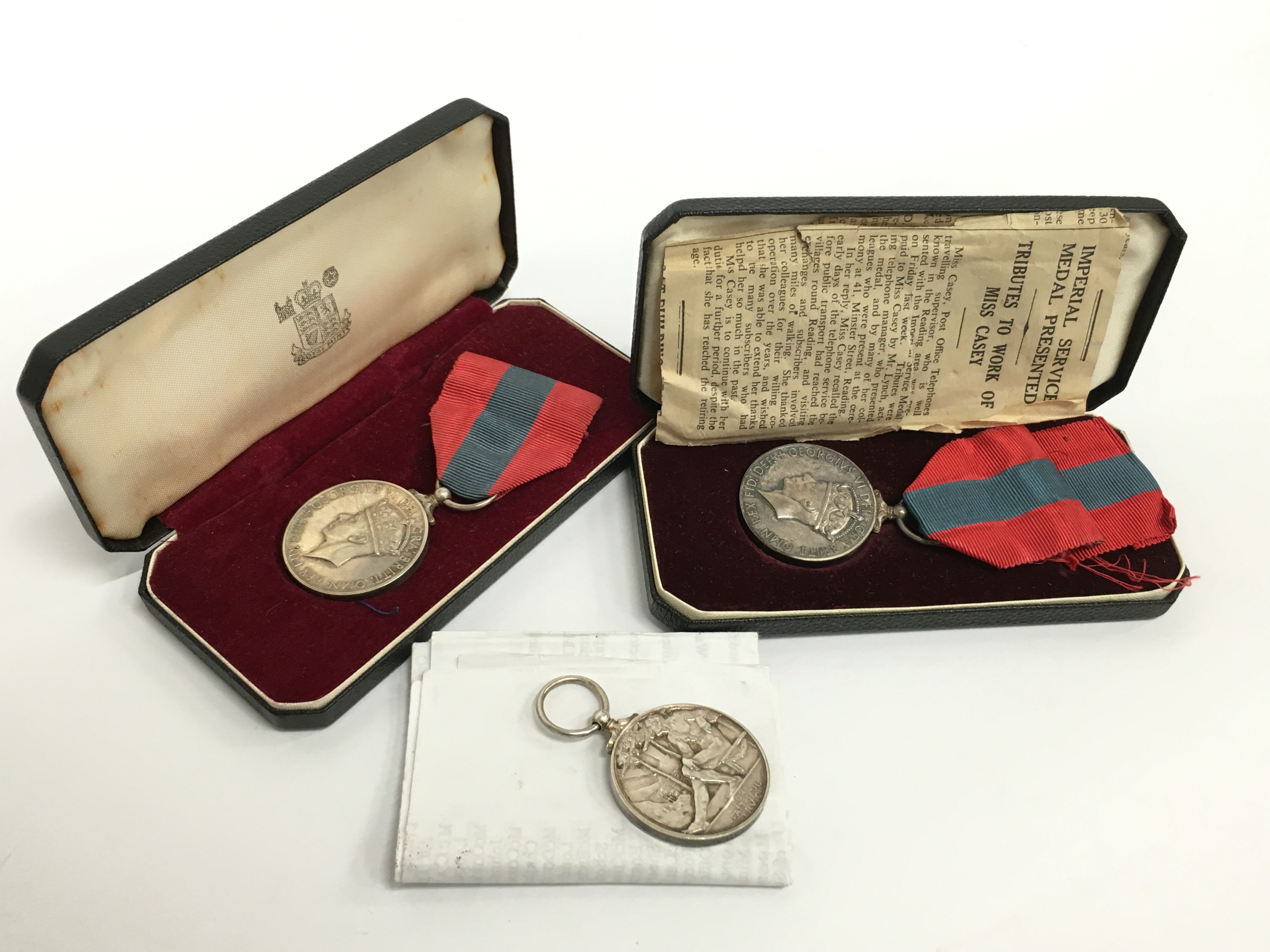 An Imperial Service medal awarded to Miss Lillian Casey in original fitted case together with two