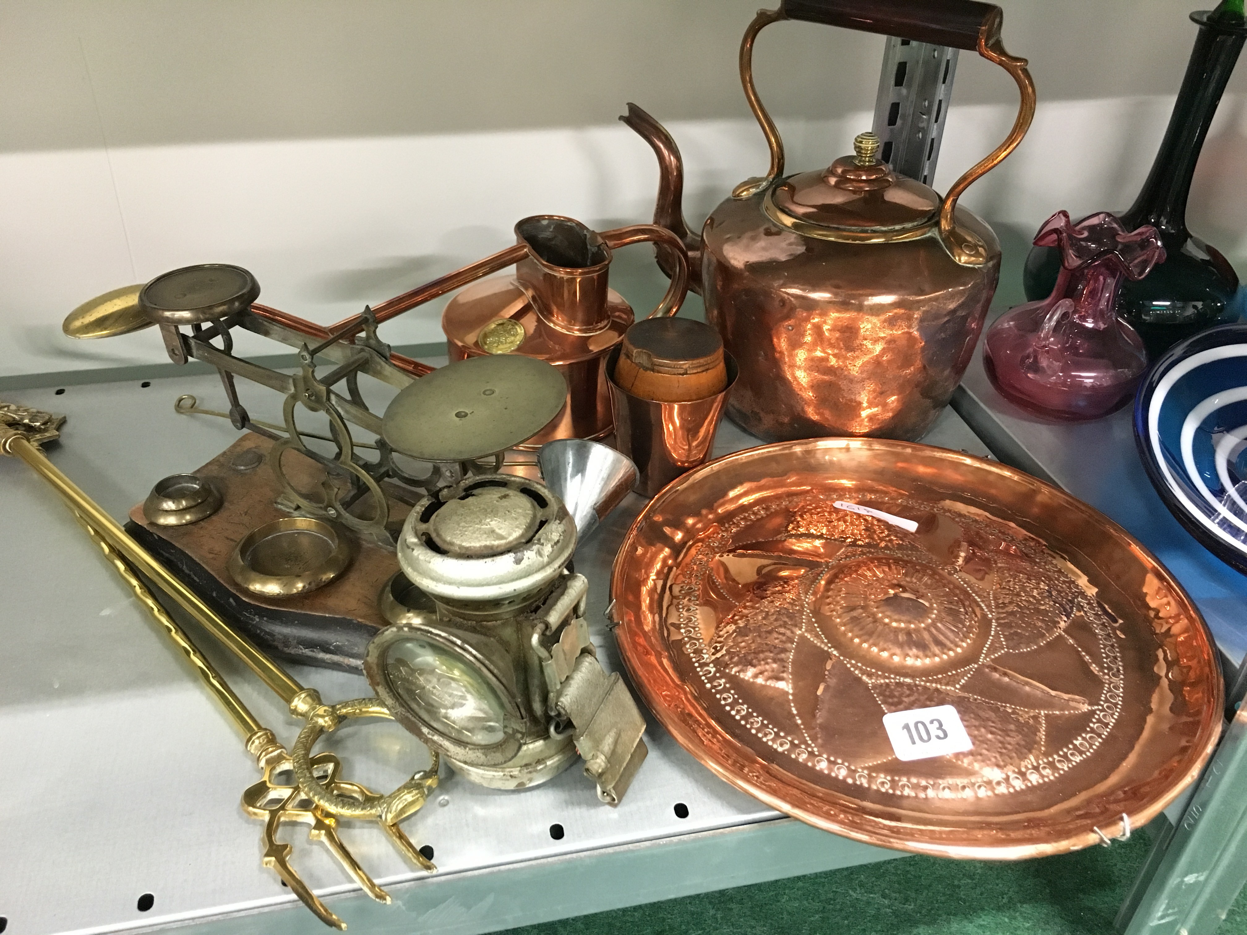 A collection of various copper items together with a set of postal scales.