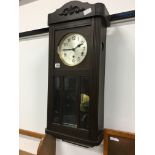 An early 20th century oak cased regulator wall clock.