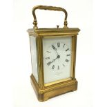 A brass and glass cased repeating carriage clock by J. W. Benson, Old Bond Street, London (12.5cm).
