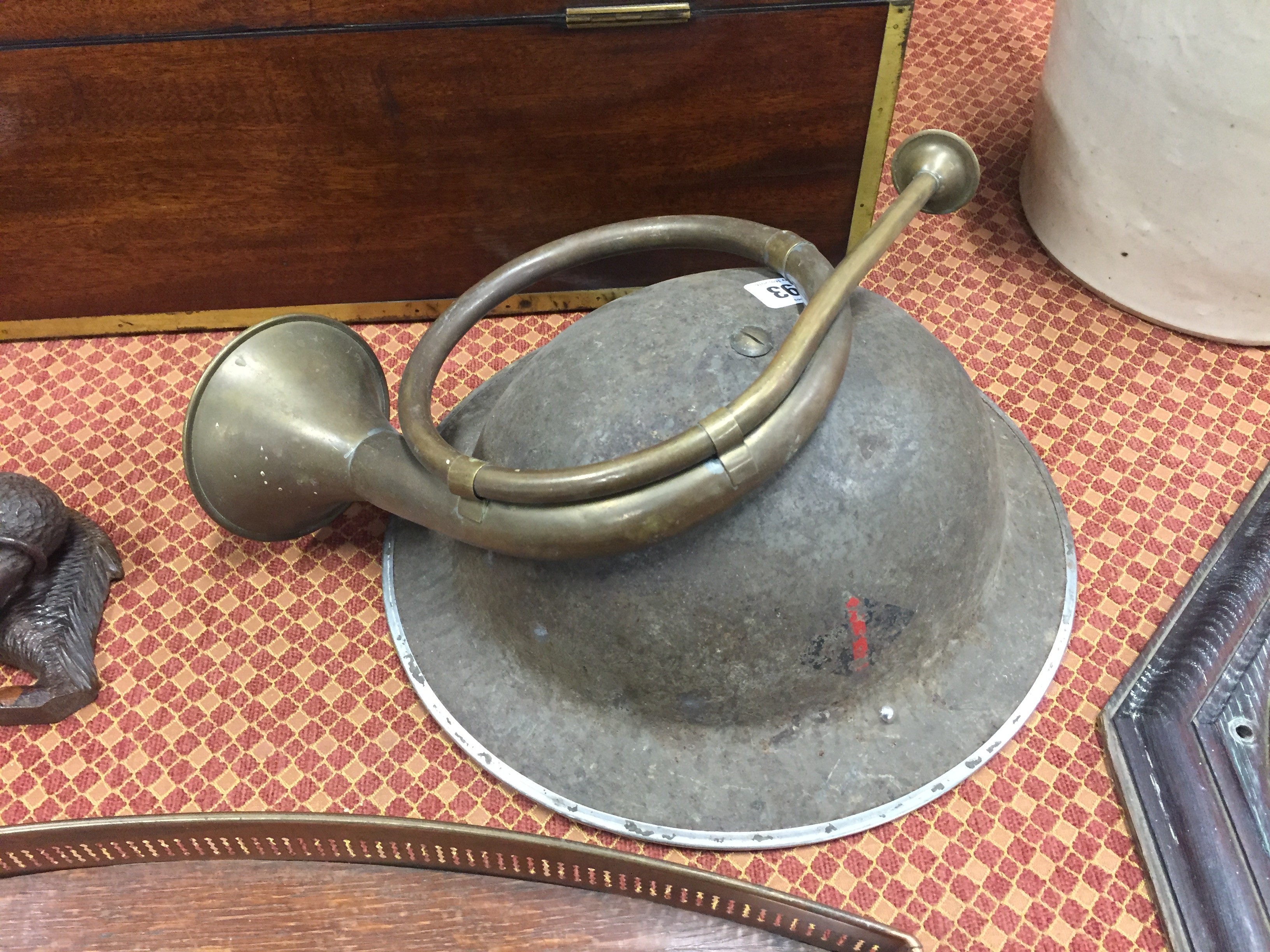 A WWII Military helmet together with a horn.