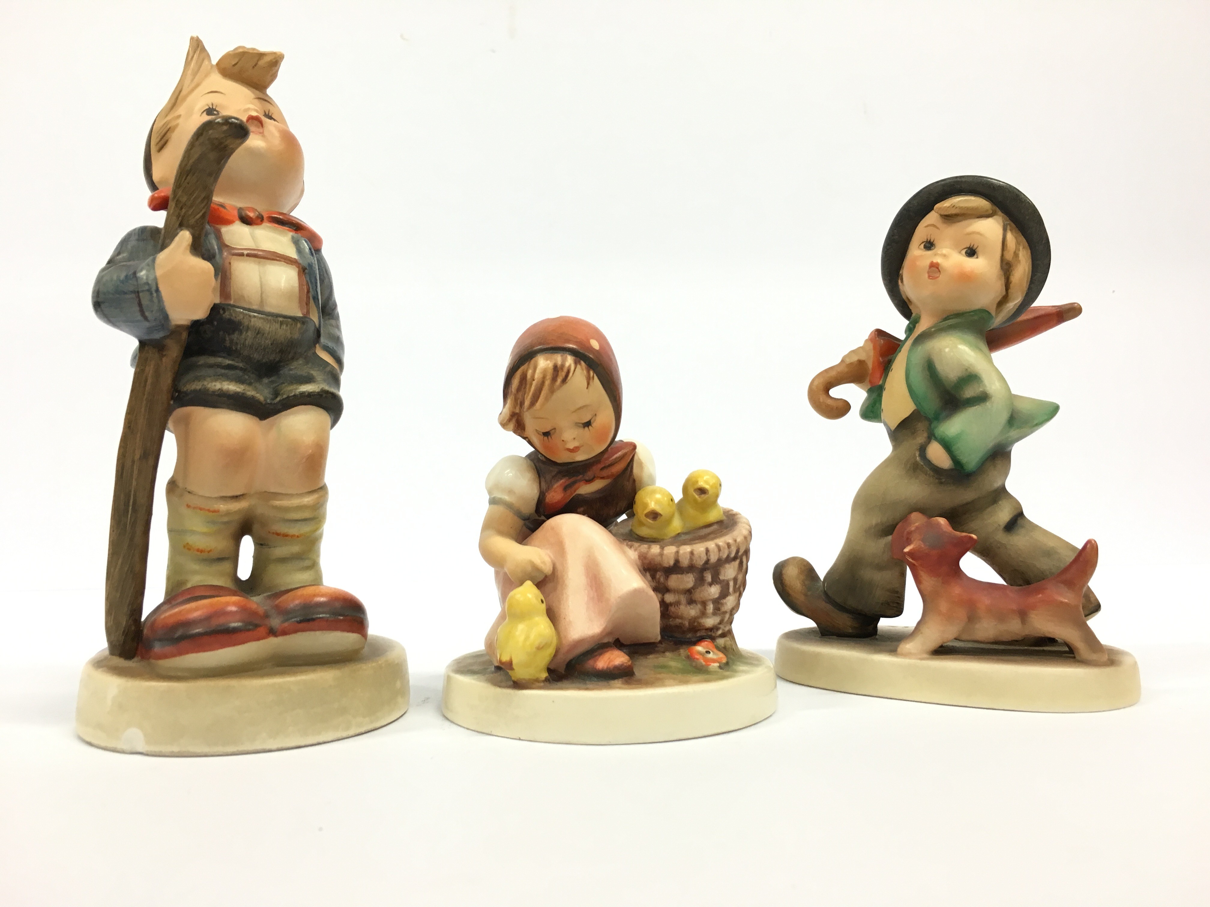 Three various Goebel Hummel figures.