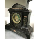 A late 19th century black slate mantle clock.