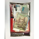 A large box containing various stamp albums and stamps.