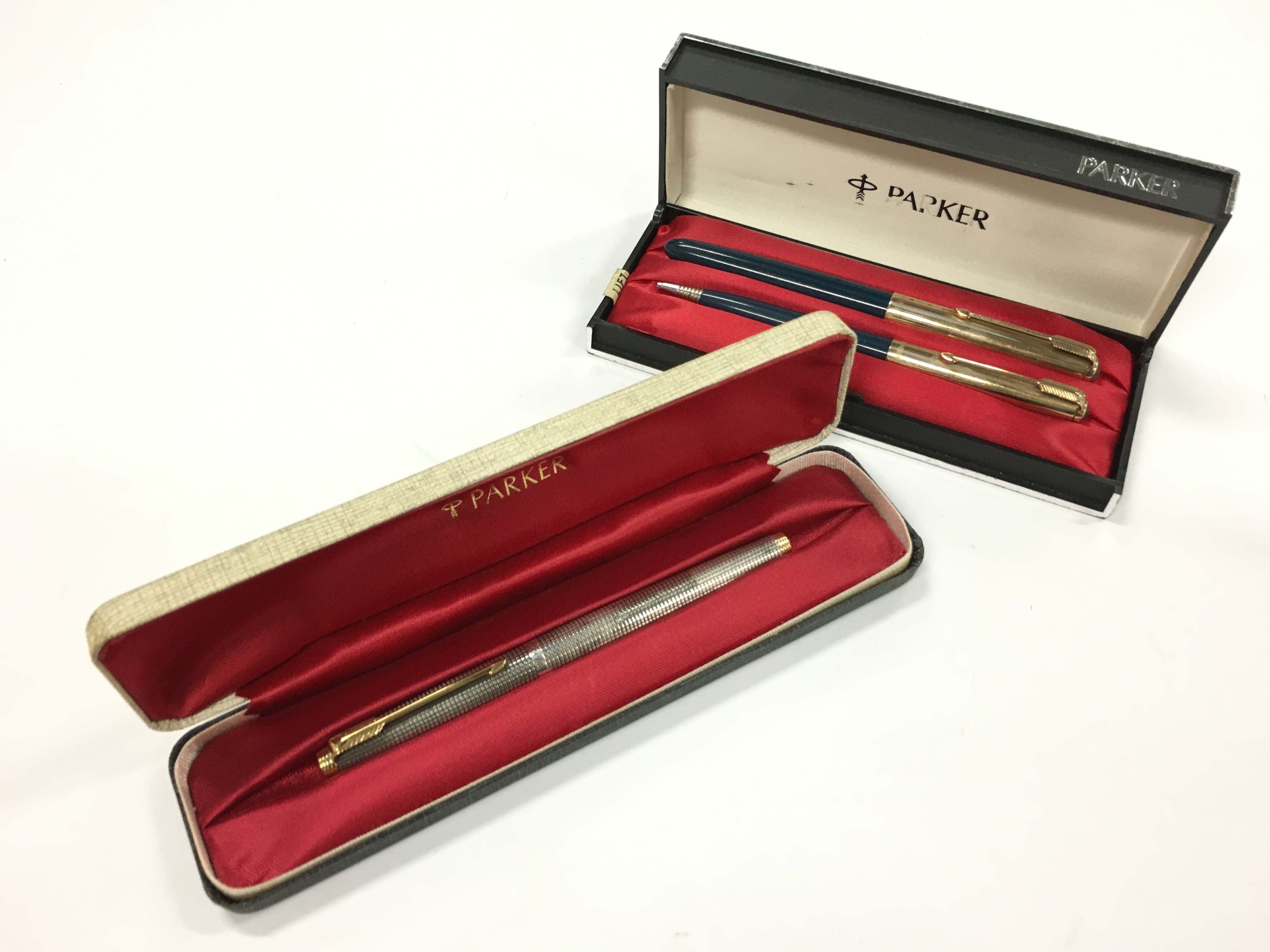 Two vintage Parker fountain pens to include a sterling silver Parker 75 flat top in original hard