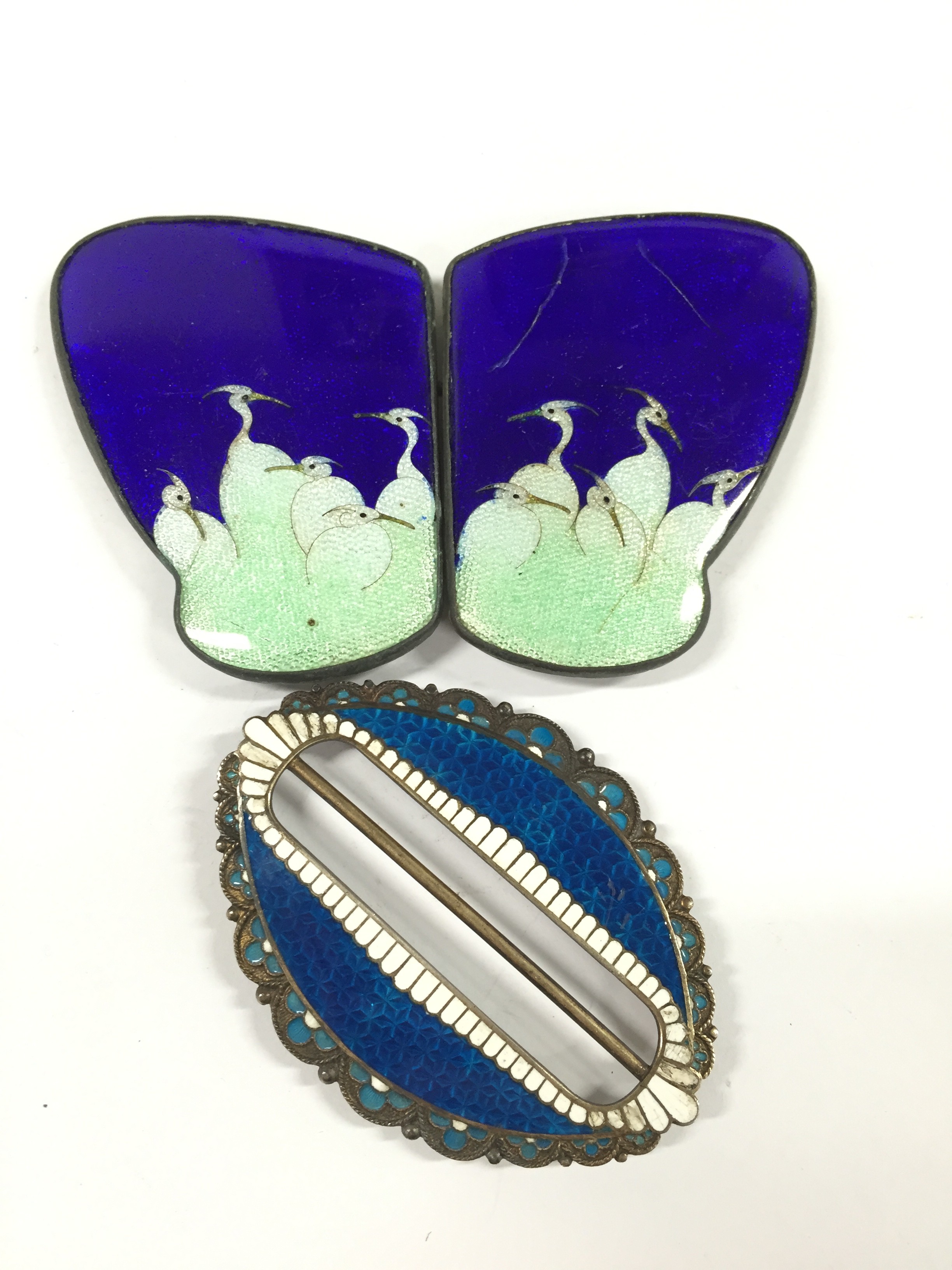 A Marius Hammer silver and enamel buckle together with a Japanese enamel buckle.