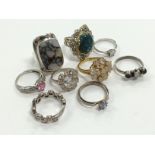 A bag containing various costume jewellery, silver and other metal rings,.