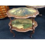 A late 19th century rosewood effect painted two tier tea table resting on shaped carved base,