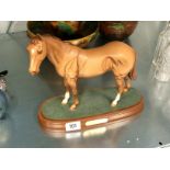 A Royal Doulton china model of a horse on wooden stand: Mr Frisk.