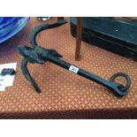 A black painted iron anchor.
