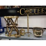 A circular brass drum table together with a brass tea caddy and other items.