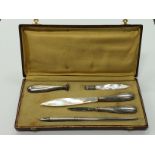 A French white metal stationery set consisting of pen, quill cutter, paper holder,