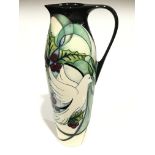 CATHEDRAL WINDOW: A tall Numbered Edition signed Moorcroft Pottery jug by Nicola Slaney (27cm high).