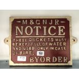 A reproduction cast iron railway sign: These buckets must be kept full of water.