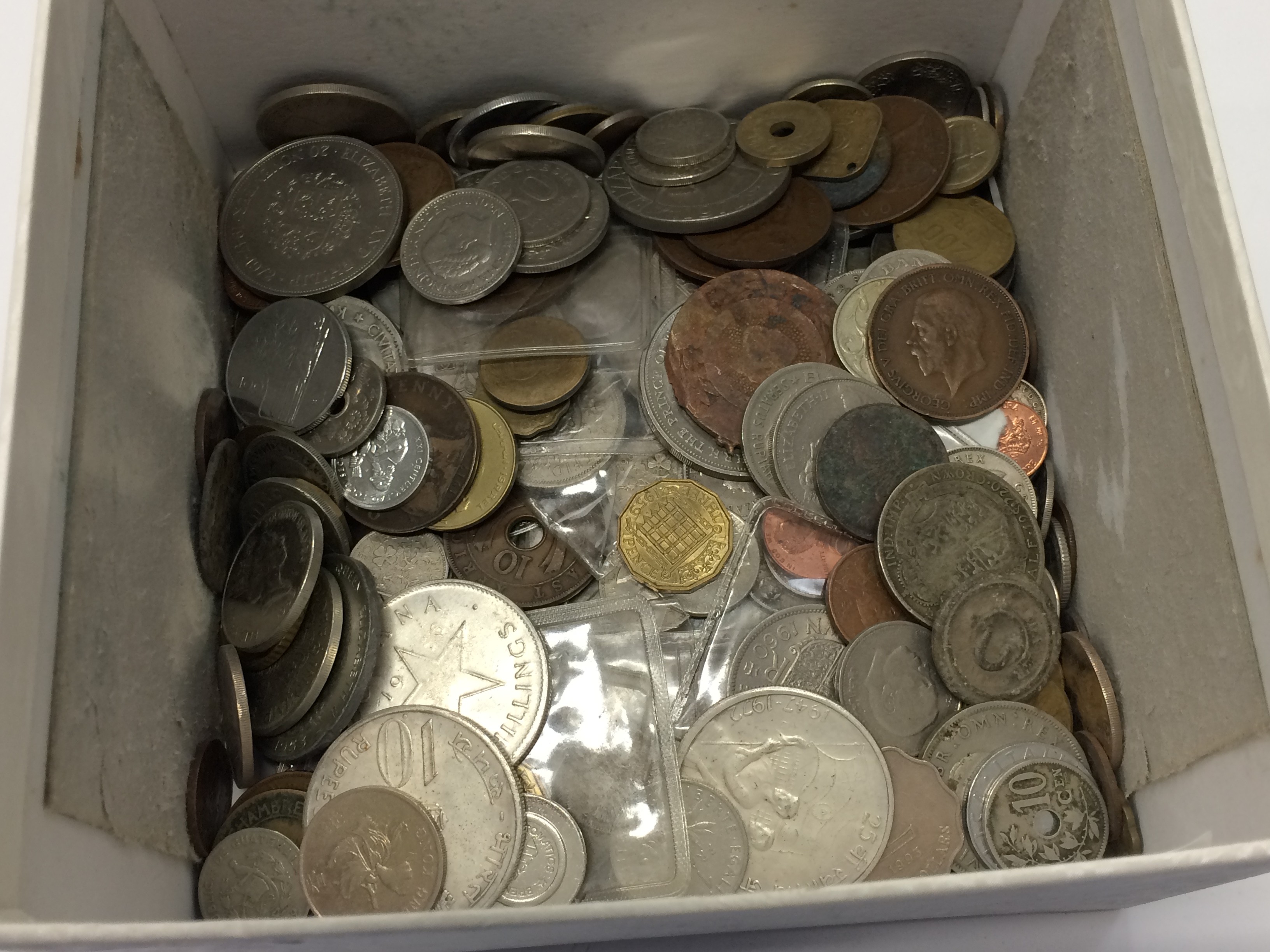 A box containing various coins.