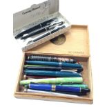A Conway Stewart pen set in box and a collection of Bakelite and plated fountain pens.