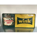 A tin plate advertising sign: Canada Dry (Wink).