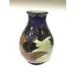 BLACK TULIP: A Moorcroft Pottery vase by Sally Tuffin (18cm high).