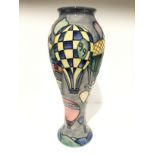 BALLOONS: A tall Moorcroft Pottery vase by Jeanne MacDougall (27cm high).