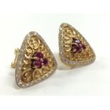 A pair of heavy 18ct gold ruby and diamond set cushioned shaped Cartier style earrings (16g)