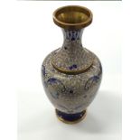 A Chinese Cloisonne vase decorated in blue enamel on a pink back ground.