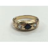 A 9 carat gold ring set with coloured stones