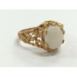 A 9 carat gold dress ring set with single opal (3.