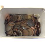 A tin of various coins.
