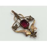 A 9 carat gold art nouveau synthetic ruby pendant