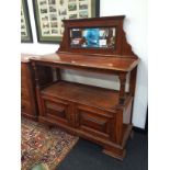 A late 19th century walnut buffet with mirror back,