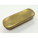 A Dutch brass engraved snuff box of oval form.