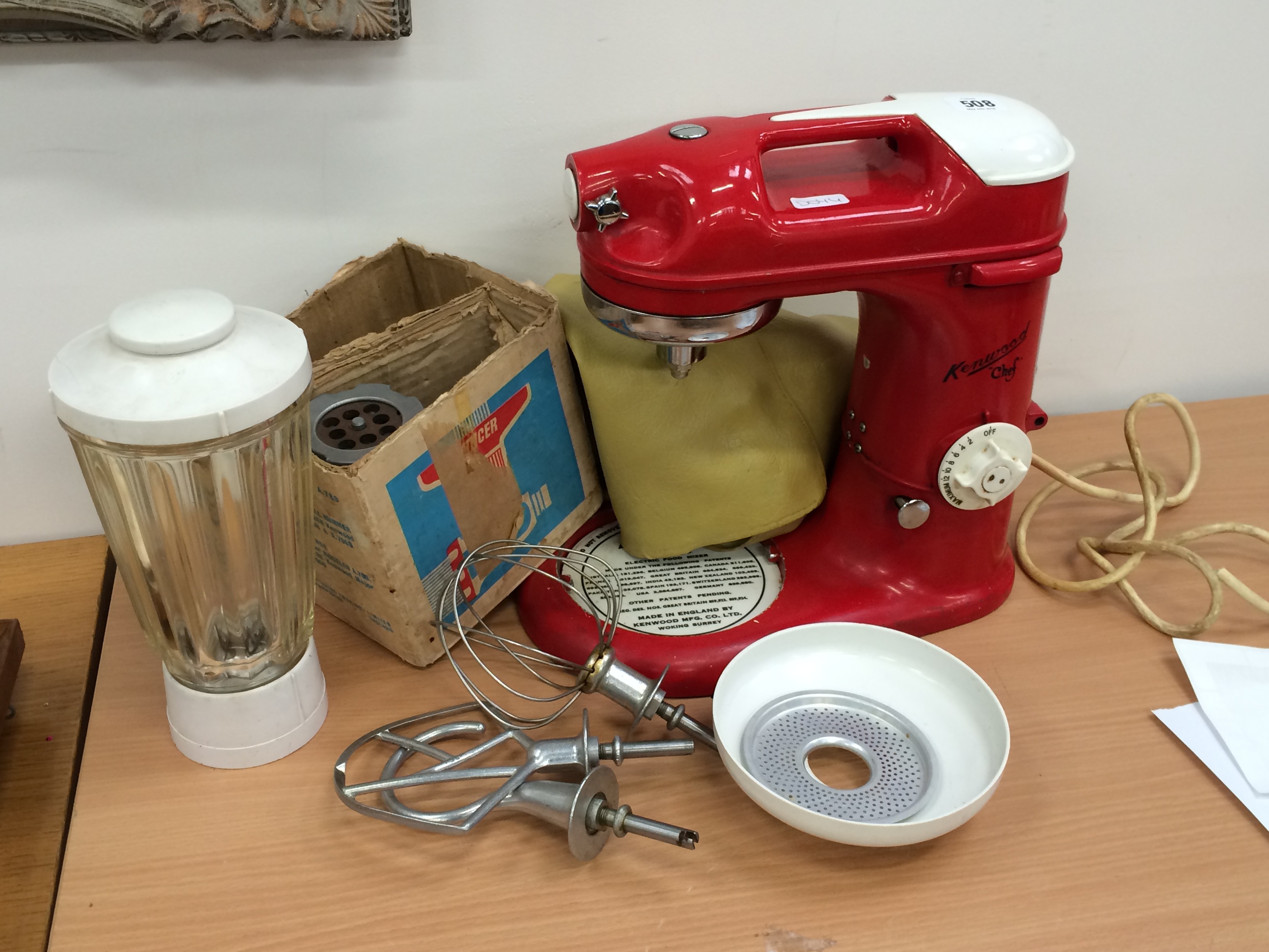 A red painted Kenwood Chef Model A700D with accessories.