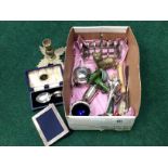 A three piece silver plated cruet set, toast rack, silver photo frame, penknives,