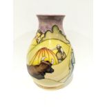 HAYSTACKS: A Trial Moorcroft Pottery vase, decorated with Gleaners Among Haystacks (18cm high).